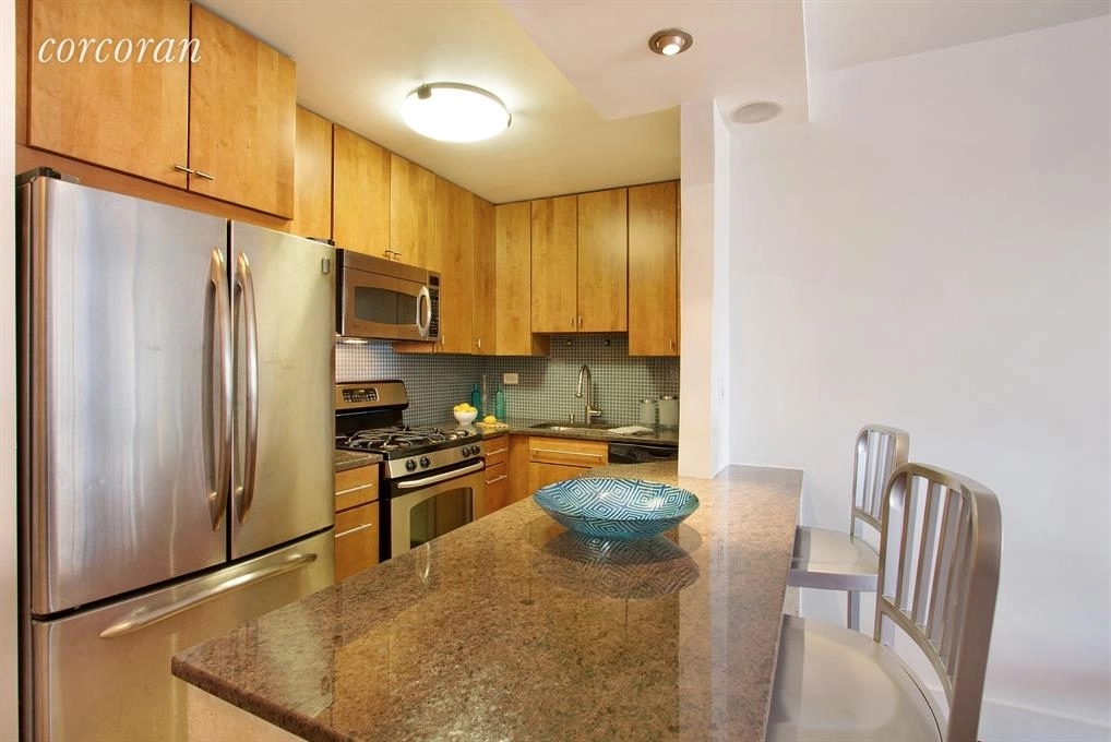 Kitchen, Dining at Unit 9D at 115 E 9th Street
