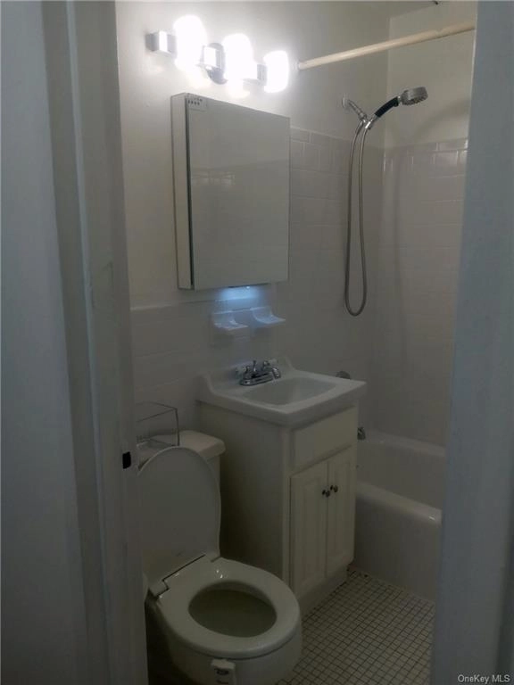 Laundry, Bathroom at Unit 1G at 2035 Central Park Avenue
