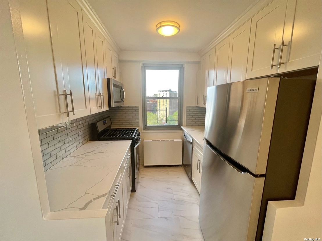Kitchen at Unit A1201 at 61-20 Grand Central Parkway