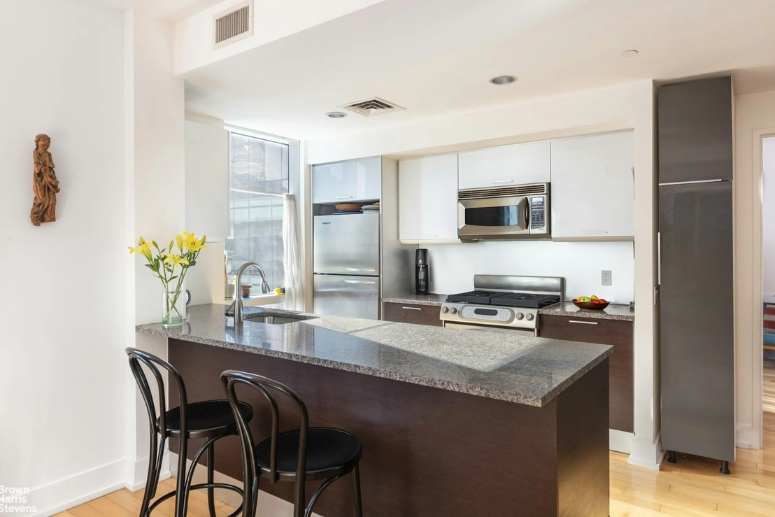 Kitchen, Dining at Unit 8G at 350 W 42ND Street