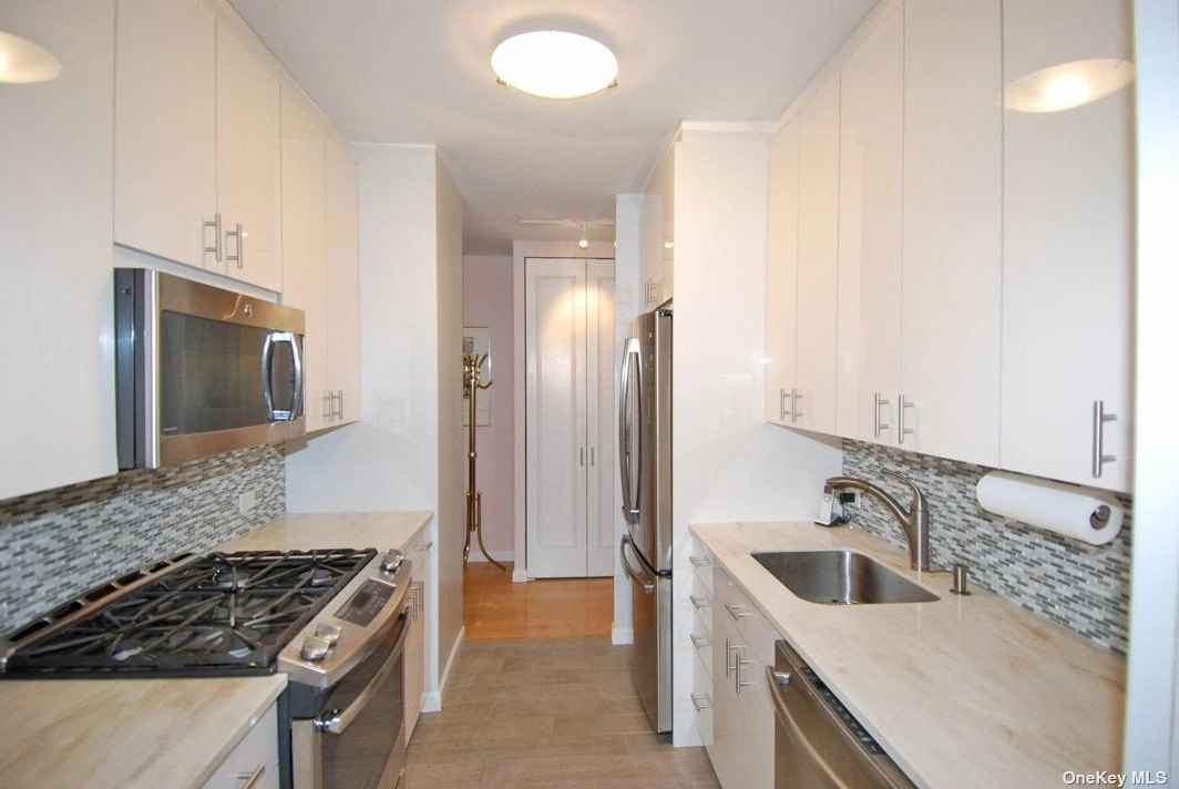 Kitchen at Unit 8S at 26910 Grand Central Parkway