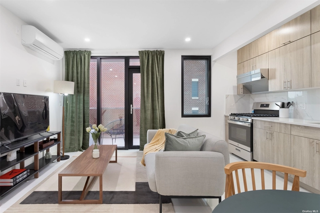 Livingroom, Kitchen, Dining at Unit 11B at 124-28 Queens Boulevard