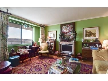 Livingroom at Unit 5CDE at 2575 Palisade Ave